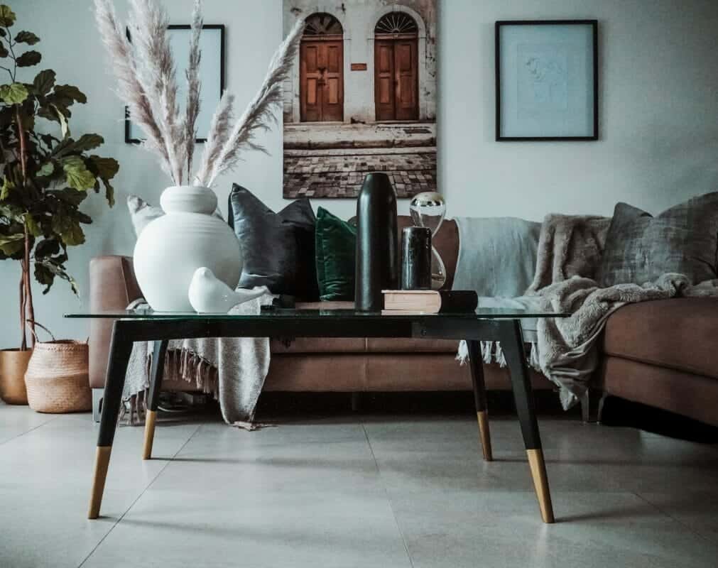 white ceramic vase on brown wooden table