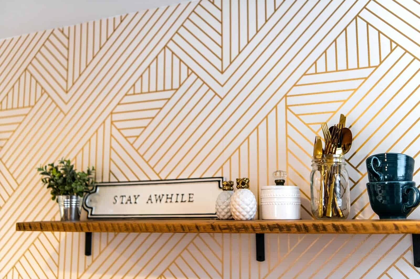 white and brown wooden wall mounted shelf